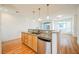 Open concept kitchen area with light wood cabinets and granite countertops at 9050 W Tropicana Ave # 1178, Las Vegas, NV 89147