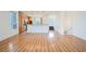 Spacious living area featuring hardwood floors, a view of the kitchen, and natural light at 9050 W Tropicana Ave # 1178, Las Vegas, NV 89147