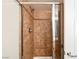 This walk-in shower features updated tilework, a modern shower head, and sliding glass doors at 9050 W Tropicana Ave # 1178, Las Vegas, NV 89147