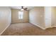 Bedroom with neutral carpeting, a ceiling fan, and two closets, offering ample storage space at 9445 Sweetwood Ave, Las Vegas, NV 89149