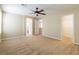 Comfortable bedroom with neutral walls, carpet, ceiling fan and access to bathroom and closet at 9445 Sweetwood Ave, Las Vegas, NV 89149