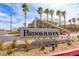 Brookhaven community entrance sign with palm trees and desert landscaping in a sunny neighborhood at 9445 Sweetwood Ave, Las Vegas, NV 89149