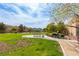 Community park featuring green grass, trees, walking path, gazebo, and seating areas at 9445 Sweetwood Ave, Las Vegas, NV 89149