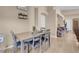 This dining area features a four-chair table, decorative wall decor and an archway to other rooms at 9604 Flying Eagle Ln, Las Vegas, NV 89123