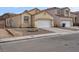 Single-story home with a two-car garage and low-maintenance landscaping at 9604 Flying Eagle Ln, Las Vegas, NV 89123