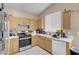 A well-equipped kitchen showcases light wood cabinets, appliances, and ample white counter space at 9604 Flying Eagle Ln, Las Vegas, NV 89123