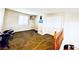 A large bonus room with a window, carpet flooring, and ample space for activities or storage at 9670 Gentle Spirit Dr, Las Vegas, NV 89148