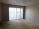 Carpeted living room with sliding glass doors for ample natural light at , Las Vegas, NV 89119