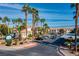Beautiful condominiums community featuring lush landscaping, a sign, and ample parking at 3318 N Decatur Blvd # 1059, Las Vegas, NV 89130