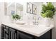 Bright bathroom featuring double sinks, modern fixtures, and tasteful decor at 10341 Birch Bluff Ln, Las Vegas, NV 89145
