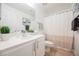 Bright bathroom with a white vanity and a shower-tub combo at 10341 Birch Bluff Ln, Las Vegas, NV 89145