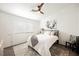 Bright bedroom featuring a ceiling fan, neutral decor, and a patterned area rug at 10341 Birch Bluff Ln, Las Vegas, NV 89145