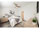 Cozy bedroom with fresh decor, neutral color palette, and a ceiling fan at 10341 Birch Bluff Ln, Las Vegas, NV 89145