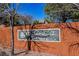The community's welcoming 'Cottonwood Terrace' sign surrounded by mature trees at 10341 Birch Bluff Ln, Las Vegas, NV 89145