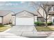 Charming single-Gathering home featuring a two-car garage, desert landscaping, and neutral color palette at 10341 Birch Bluff Ln, Las Vegas, NV 89145