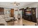 Inviting living room featuring a cozy sectional, a built-in entertainment center, and a sliding barn door leading to another room at 1050 Cracker Barrel Cir, Mesquite, NV 89034