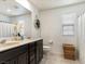 Bathroom with double vanity sinks and a decorative wicker basket at 10909 Prudhoe Bay St, Las Vegas, NV 89179