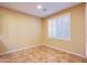 Cozy bedroom with a large window and tiled floor at 11242 Almador Vista Ct, Las Vegas, NV 89135