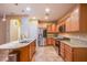 Modern kitchen with granite counters, stainless steel appliances, and an island at 11242 Almador Vista Ct, Las Vegas, NV 89135