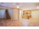 Open-concept living area featuring tile floors and seamless transition to the kitchen at 11242 Almador Vista Ct, Las Vegas, NV 89135