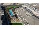 Overhead shot of a new community featuring a pool, palm trees, and green spaces at 11439 Peak Landing Ave, Las Vegas, NV 89138