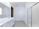 Bright bathroom features double vanity with modern fixtures and a glass-enclosed shower at 11439 Peak Landing Ave, Las Vegas, NV 89138