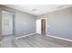 Neutral bedroom with hardwood floors, walk-in closet, and ensuite bathroom at 11439 Peak Landing Ave, Las Vegas, NV 89138