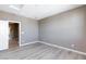 Neutral bedroom with hardwood floors, open doorway, and calming ambiance at 11439 Peak Landing Ave, Las Vegas, NV 89138