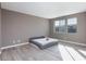 Spacious bedroom with plenty of natural light and light wood flooring at 11439 Peak Landing Ave, Las Vegas, NV 89138