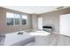 Bright bedroom with hard wood flooring, plenty of natural light and a comfortable bed at 11439 Peak Landing Ave, Las Vegas, NV 89138