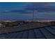 Distant Las Vegas skyline, view of the city lights from the roof of a new home at 11439 Peak Landing Ave, Las Vegas, NV 89138
