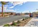 Gated entry to new homes, enhanced by desert landscaping, provides privacy and security with mountain views at 11439 Peak Landing Ave, Las Vegas, NV 89138