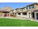 Beautiful two-story townhouse featuring a well-maintained lawn and mountain views at 11439 Peak Landing Ave, Las Vegas, NV 89138