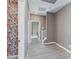 Light filled hallway features decorative wallpaper and leads to the staircase at 11439 Peak Landing Ave, Las Vegas, NV 89138