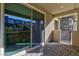 Enclosed outdoor patio with neutral colored walls and sliding glass doors at 11439 Peak Landing Ave, Las Vegas, NV 89138