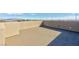 Expansive rooftop deck with stucco walls and beautiful mountain views offers a private outdoor living space at 11439 Peak Landing Ave, Las Vegas, NV 89138