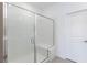 Glass enclosed shower featuring a built in bench and tiled walls at 11439 Peak Landing Ave, Las Vegas, NV 89138