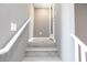 Modern staircase with wooden steps and white railings leading to the upper level at 11439 Peak Landing Ave, Las Vegas, NV 89138