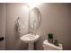 Charming powder room boasts a pedestal sink and tasteful decor at 11701 Hatchling Ave, Las Vegas, NV 89138