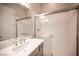Bathroom features a stylish glass shower and modern gray vanity at 11701 Hatchling Ave, Las Vegas, NV 89138