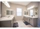 Primary bathroom featuring dual sinks, large mirrors, and modern fixtures at 11701 Hatchling Ave, Las Vegas, NV 89138