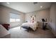 Relaxing primary bedroom with neutral tones, carpet flooring and plenty of natural light at 11701 Hatchling Ave, Las Vegas, NV 89138