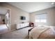 Primary bedroom featuring neutral paint, carpet flooring, and backyard patio access at 11701 Hatchling Ave, Las Vegas, NV 89138