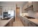 Beautiful kitchen features gray cabinets, stainless steel appliances, and a stylish backsplash at 11701 Hatchling Ave, Las Vegas, NV 89138