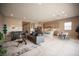 Open-concept living space with modern furnishings, a kitchen island, and a dining area at 11701 Hatchling Ave, Las Vegas, NV 89138