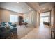 Modern office space with glass sliding doors, a work area, and a comfortable seating area at 11701 Hatchling Ave, Las Vegas, NV 89138