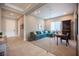 Bright office features glass doors, a comfortable sofa, desk, and access to the home's entry at 11701 Hatchling Ave, Las Vegas, NV 89138