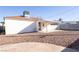 Backyard with gravel, patio, and the exterior of the building at 119 Cedar St, Henderson, NV 89015