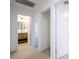 Bright bathroom features a round mirror and modern vanity with open shelving at 119 Cedar St, Henderson, NV 89015