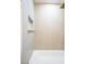 The bathroom features sleek gray tile with a built-in shower niche at 119 Cedar St, Henderson, NV 89015